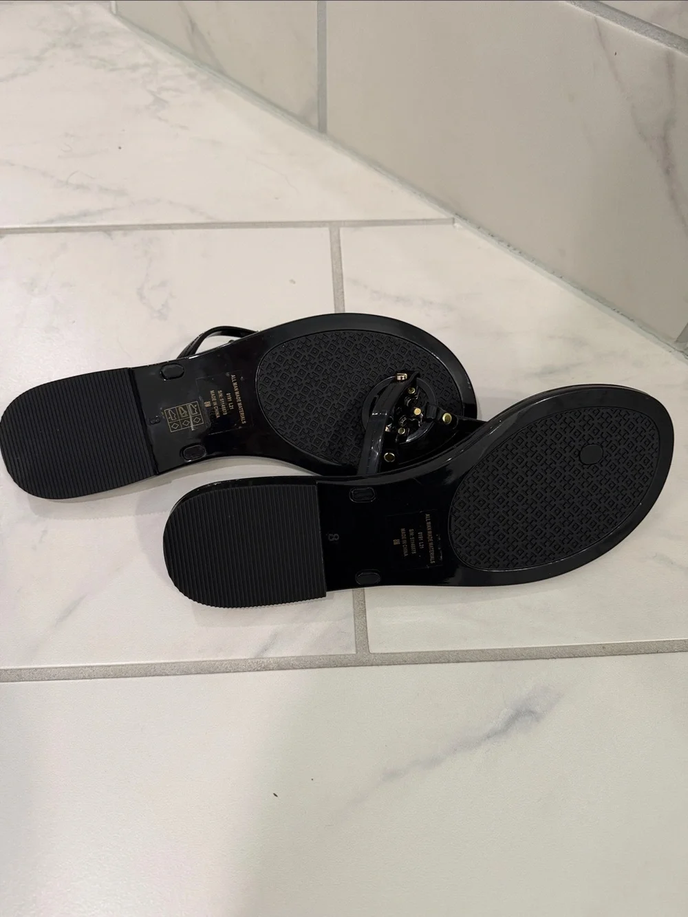 Tory Burch Black Jelly Logo Thong Sandals with Gold Emblem